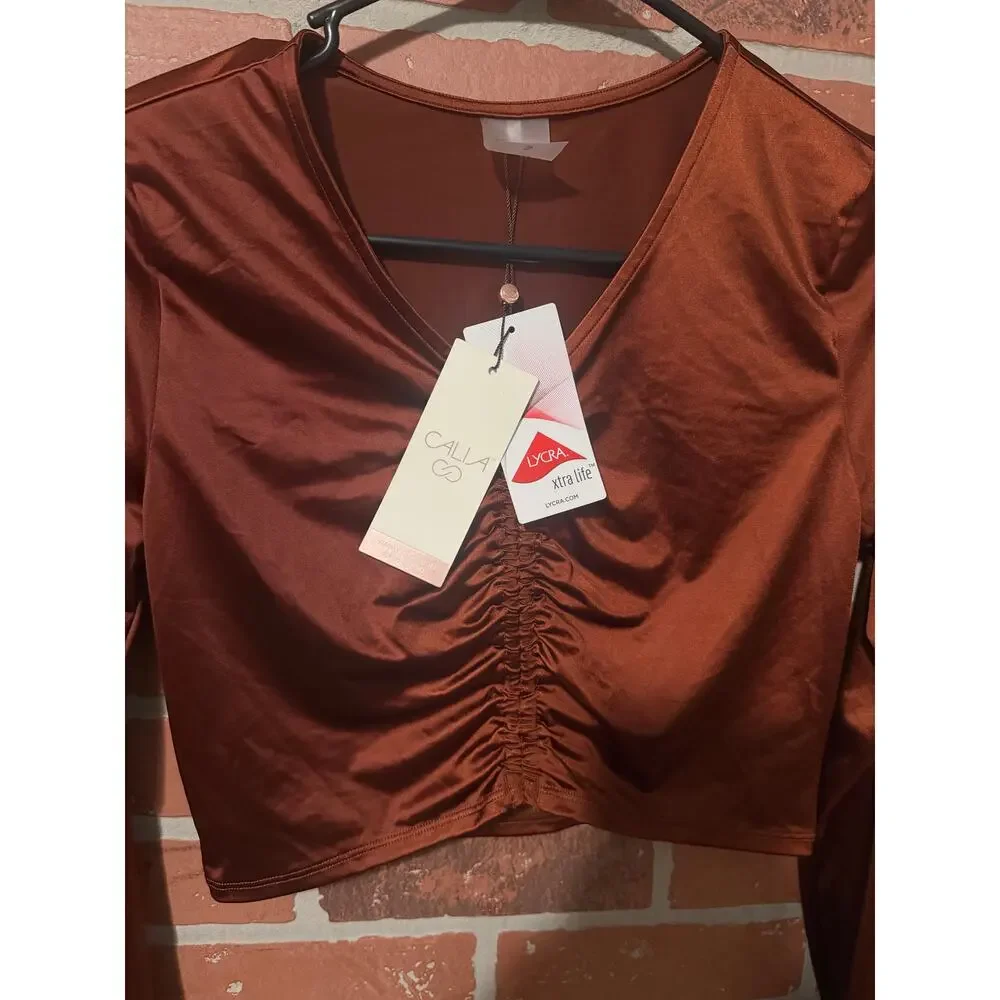NWT/NWOT Calia long sleeve ruched swim rashguard in a red brown/copper color